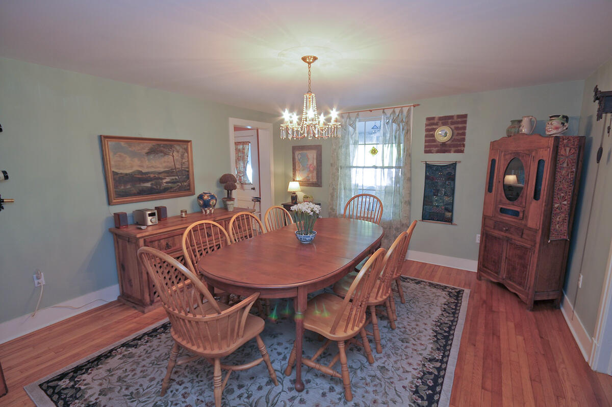 492 Greenhouse Road Lexington, VA 24450 - Photo 8 of 27 a view of a dining room with furniture wooden floor and chandelier
