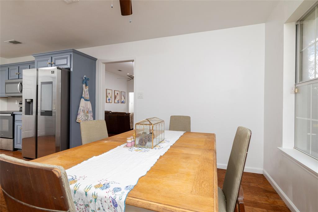 1908 Monte Cristo Drive Sherman, TX 75092 - Photo 11 of 38 a bedroom with a bed and wooden floor