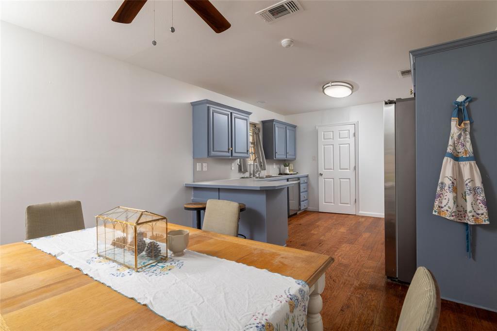 1908 Monte Cristo Drive Sherman, TX 75092 - Photo 12 of 38 a living room with kitchen island furniture and a kitchen view
