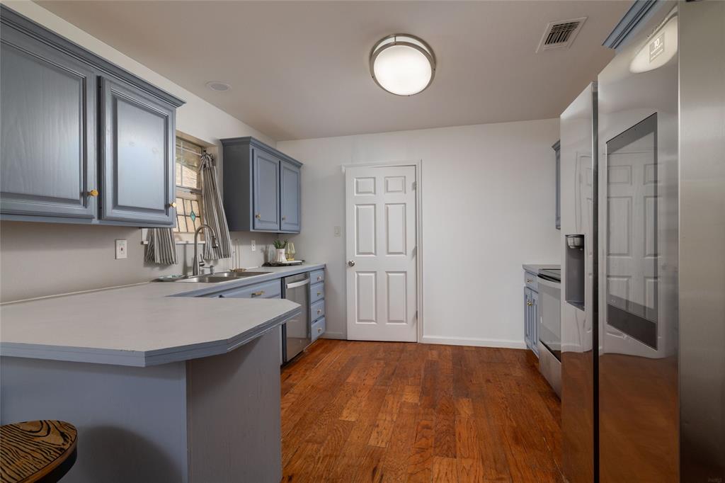 1908 Monte Cristo Drive Sherman, TX 75092 - Photo 15 of 38 a kitchen with a sink stove and refrigerator