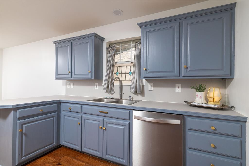 1908 Monte Cristo Drive Sherman, TX 75092 - Photo 16 of 38 a kitchen with granite countertop stainless steel appliances white cabinets sink and dishwasher