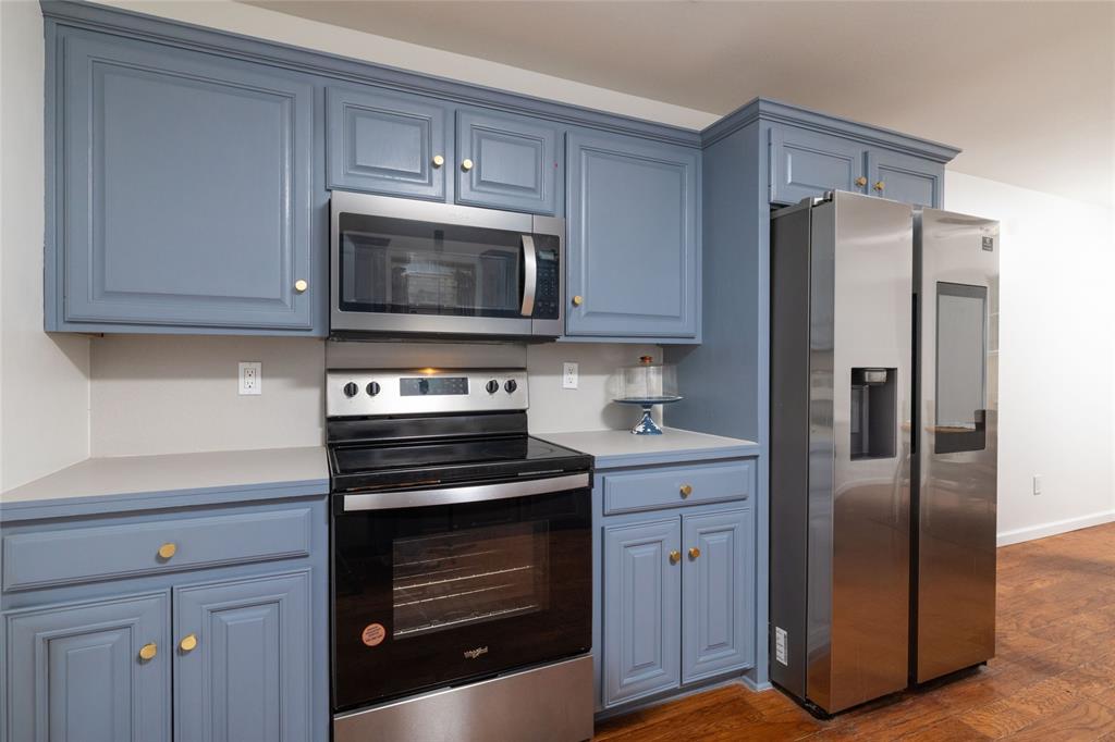 1908 Monte Cristo Drive Sherman, TX 75092 - Photo 17 of 38 a kitchen with cabinets stainless steel appliances and a counter space