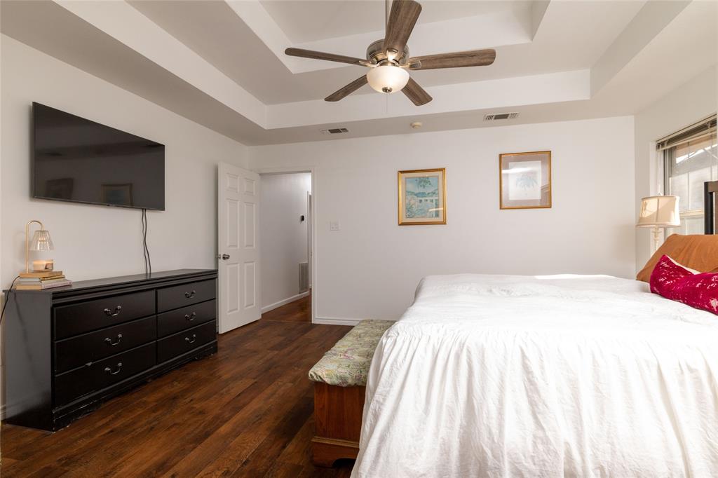1908 Monte Cristo Drive Sherman, TX 75092 - Photo 21 of 38 a bedroom with a bed and a flat screen tv