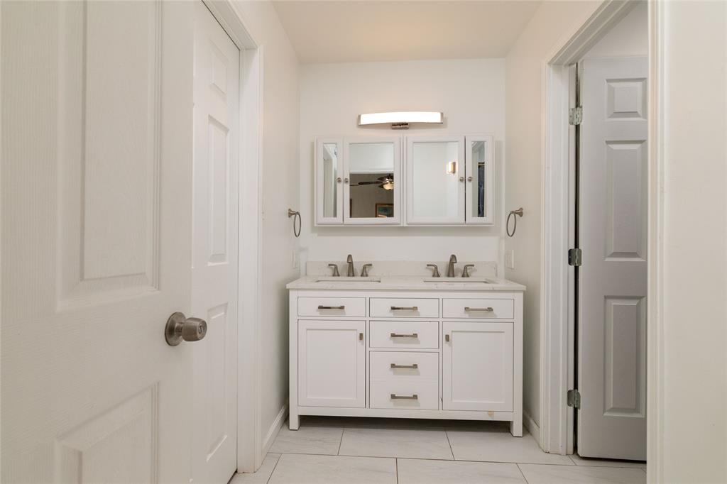1908 Monte Cristo Drive Sherman, TX 75092 - Photo 22 of 38 a bathroom with a sink vanity and mirror