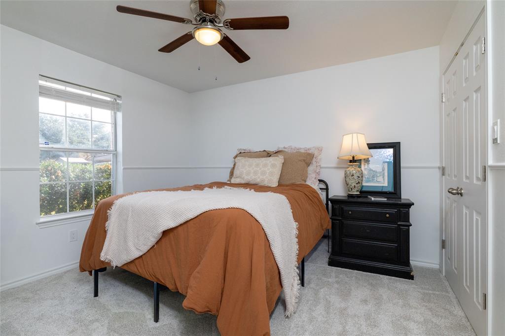 1908 Monte Cristo Drive Sherman, TX 75092 - Photo 26 of 38 a bedroom with a bed and a window