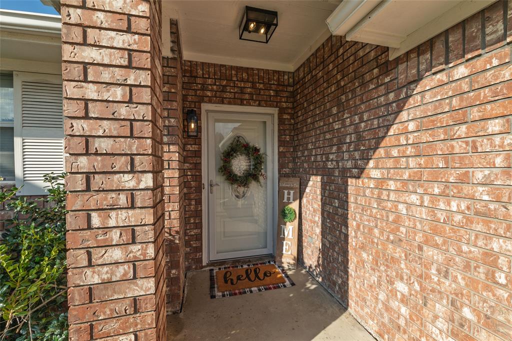 1908 Monte Cristo Drive Sherman, TX 75092 - Photo 3 of 38 a front view of a house with a door