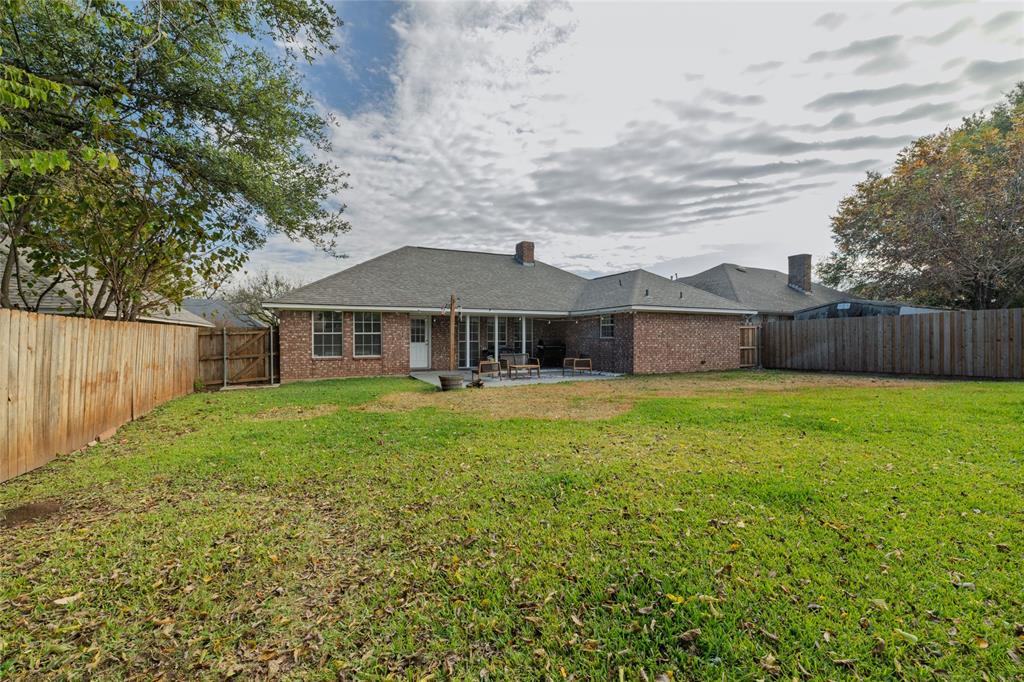 1908 Monte Cristo Drive Sherman, TX 75092 - Photo 32 of 38 a front view of a house with yard and green space