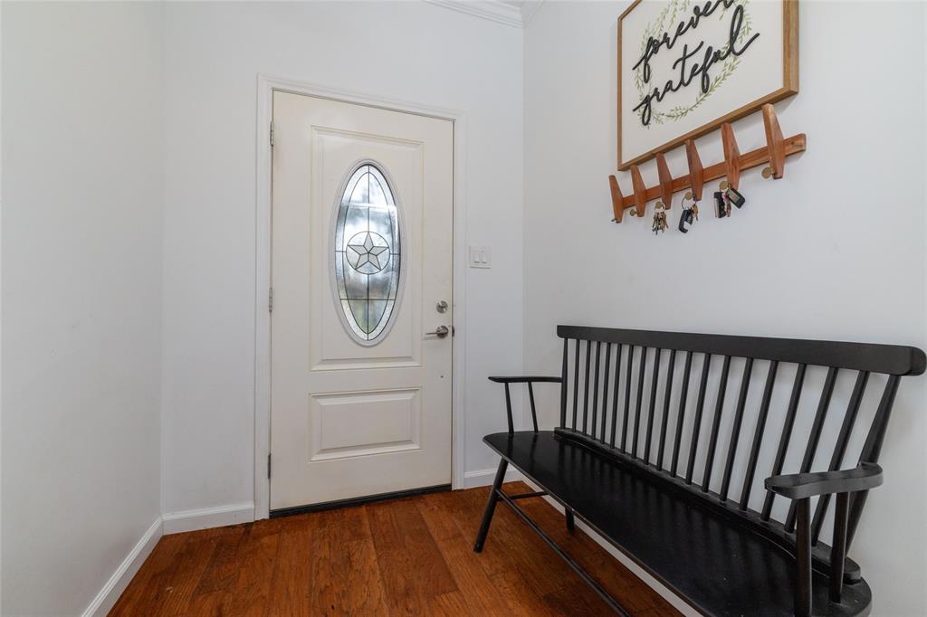 1908 Monte Cristo Drive Sherman, TX 75092 - Photo 4 of 38 a view of a hallway with wooden floor and a window