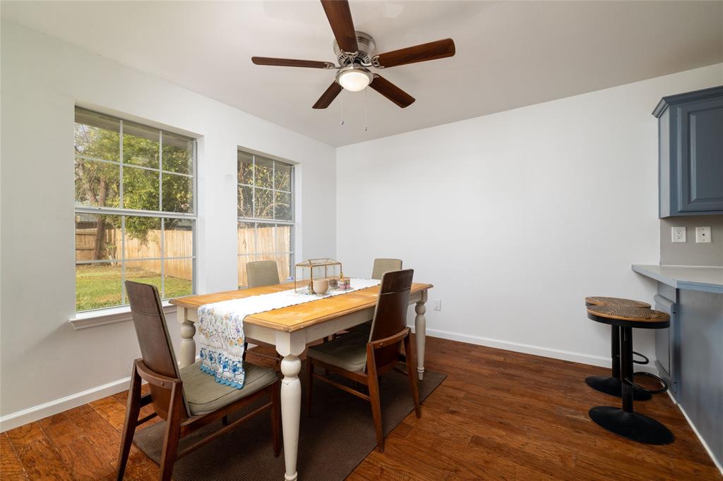1908 Monte Cristo Drive Sherman, TX 75092 - Photo 9 of 38 a view of a dining room with furniture window and wooden floor