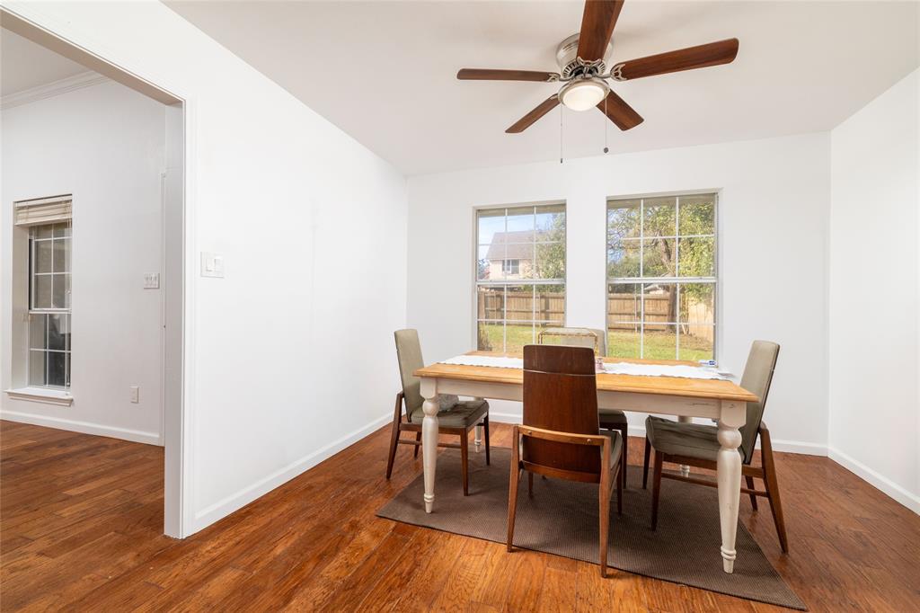 1908 Monte Cristo Drive Sherman, TX 75092 - Photo 10 of 38 a view of a dining room with furniture window and wooden floor