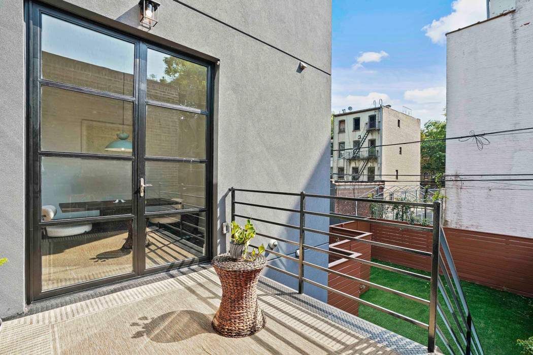 682 Madison Street Brooklyn, NY 11221 - Photo 22 of 28 a balcony view with a seating space