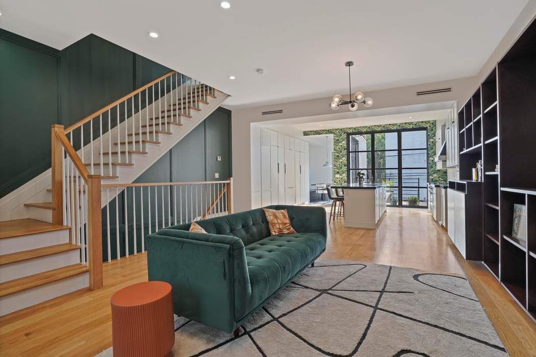 682 Madison Street Brooklyn, NY 11221 - Photo 6 of 28 a living room with furniture and wooden floor