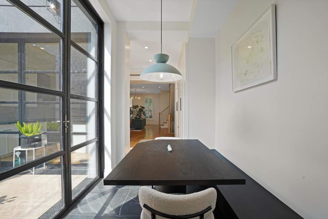 682 Madison Street Brooklyn, NY 11221 - Photo 7 of 28 a workspace with furniture and window