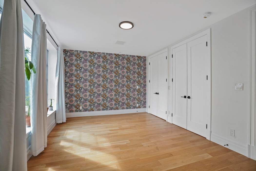 682 Madison Street Brooklyn, NY 11221 - Photo 9 of 28 a view of an empty room with a window