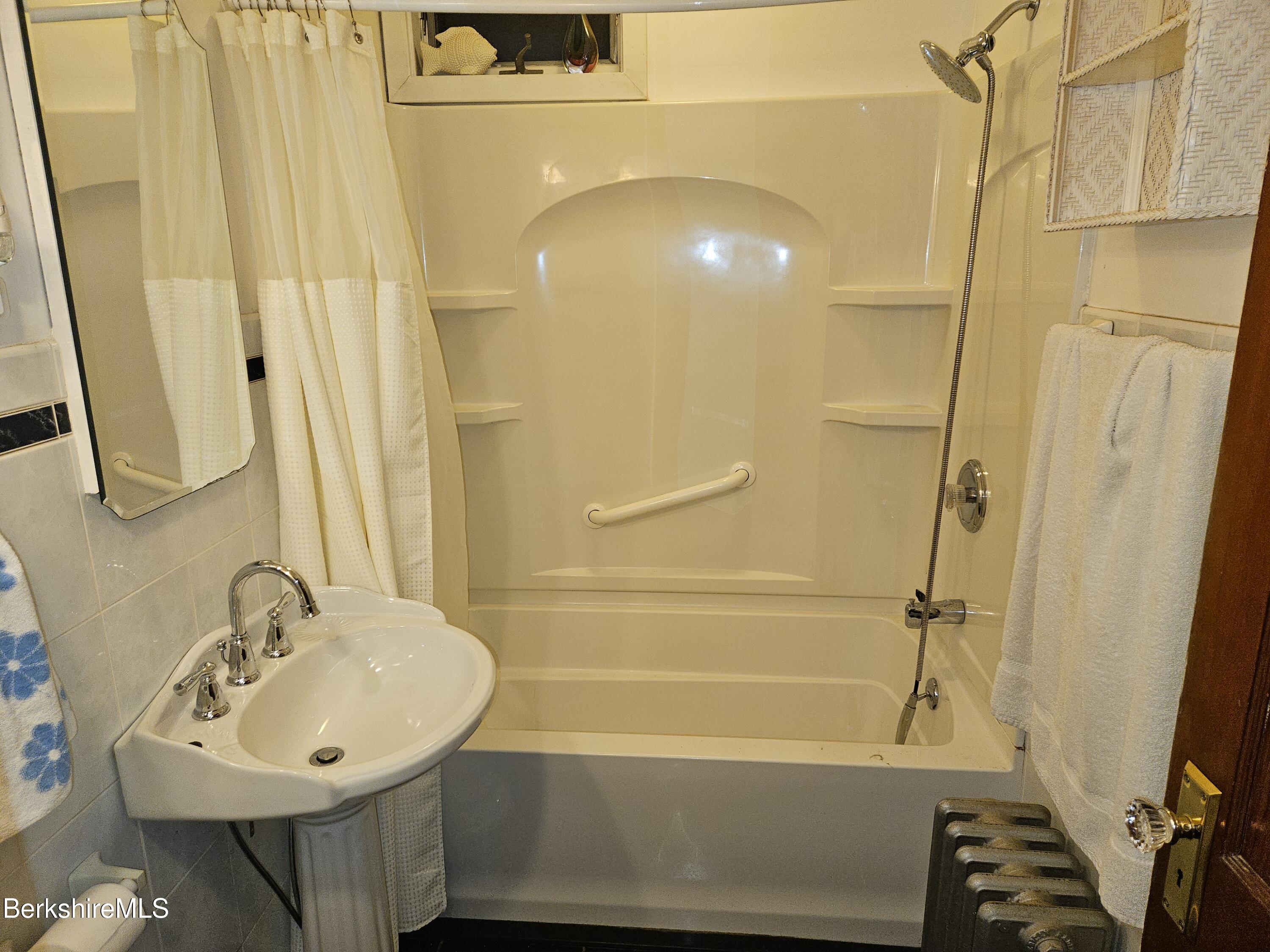 269 2nd Street Pittsfield, MA 01201 - Photo 24 of 39 a bathroom with a sink a toilet and shower