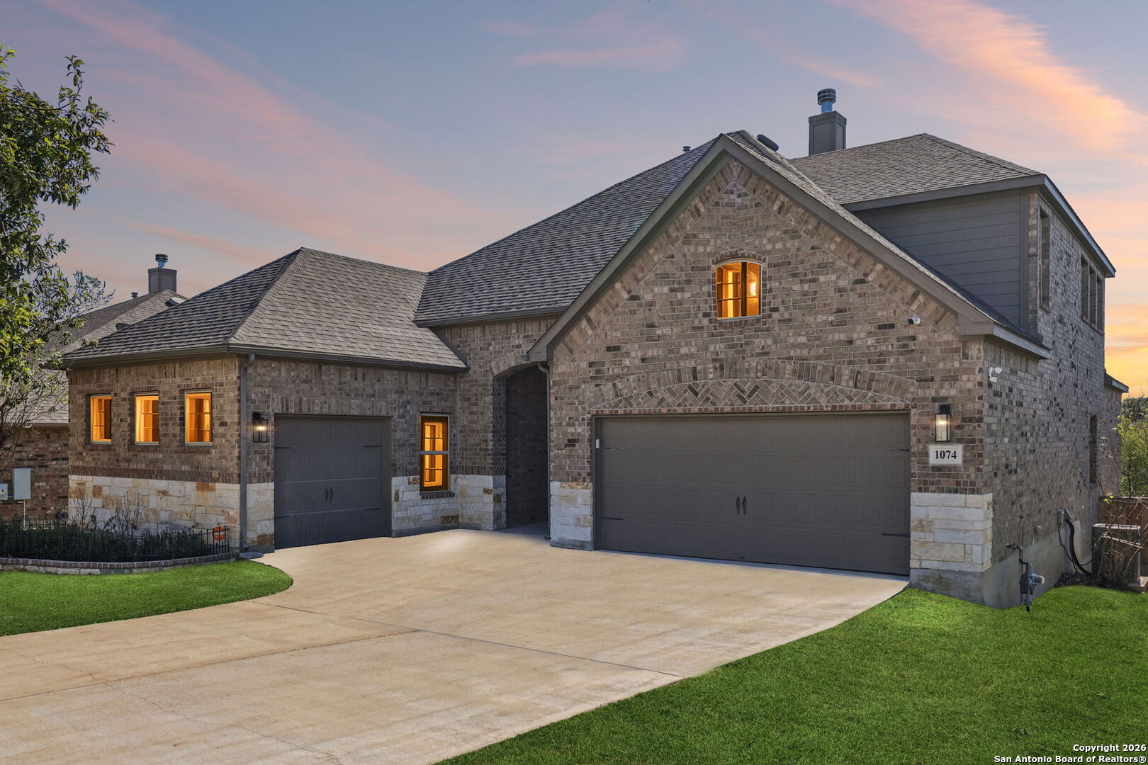 a front view of a house with a yard