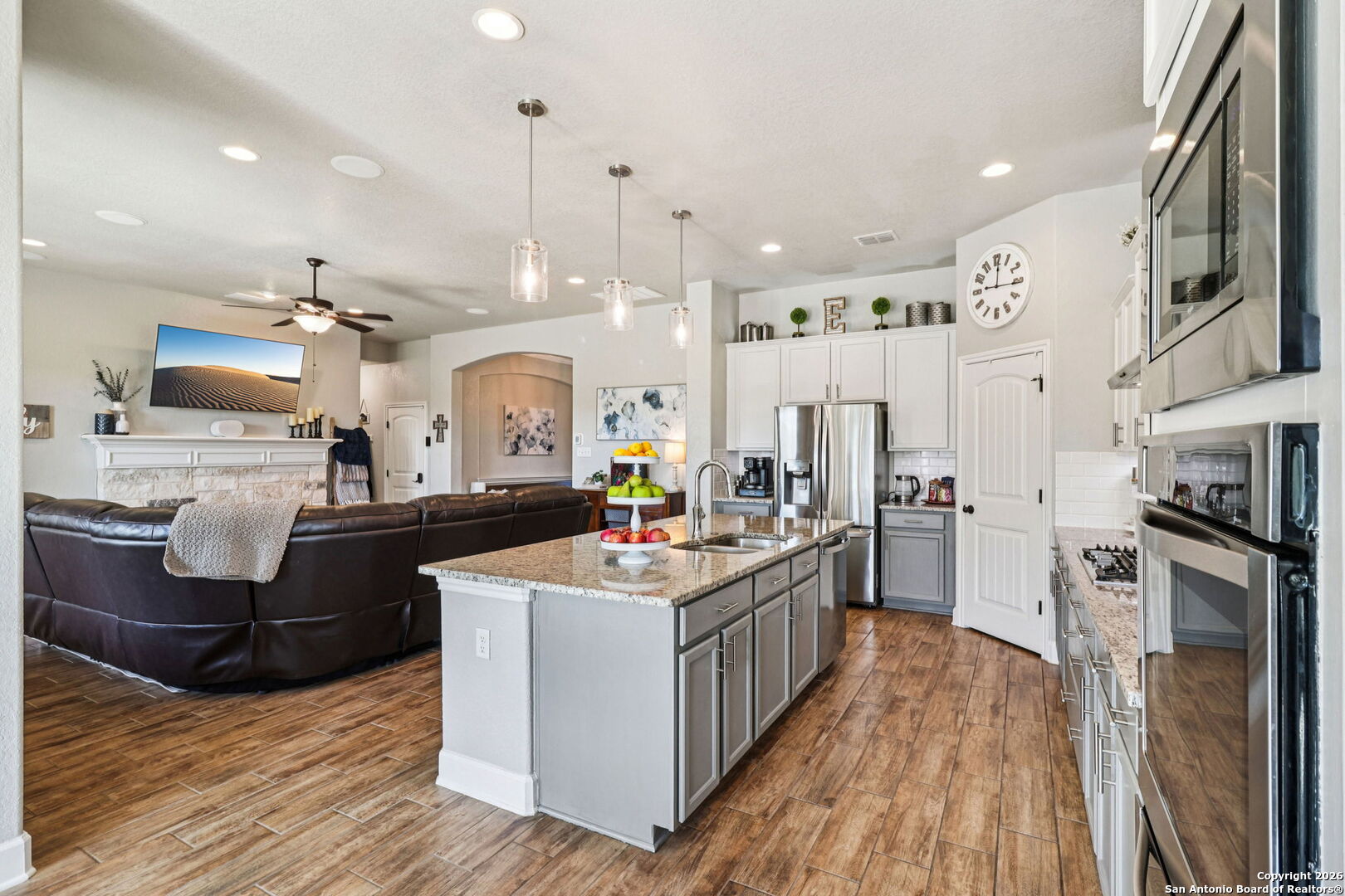 1074 Boulder New Braunfels, TX 78132 - Photo 14 of 40 a large kitchen with stainless steel appliances kitchen island granite countertop a stove and a refrigerator
