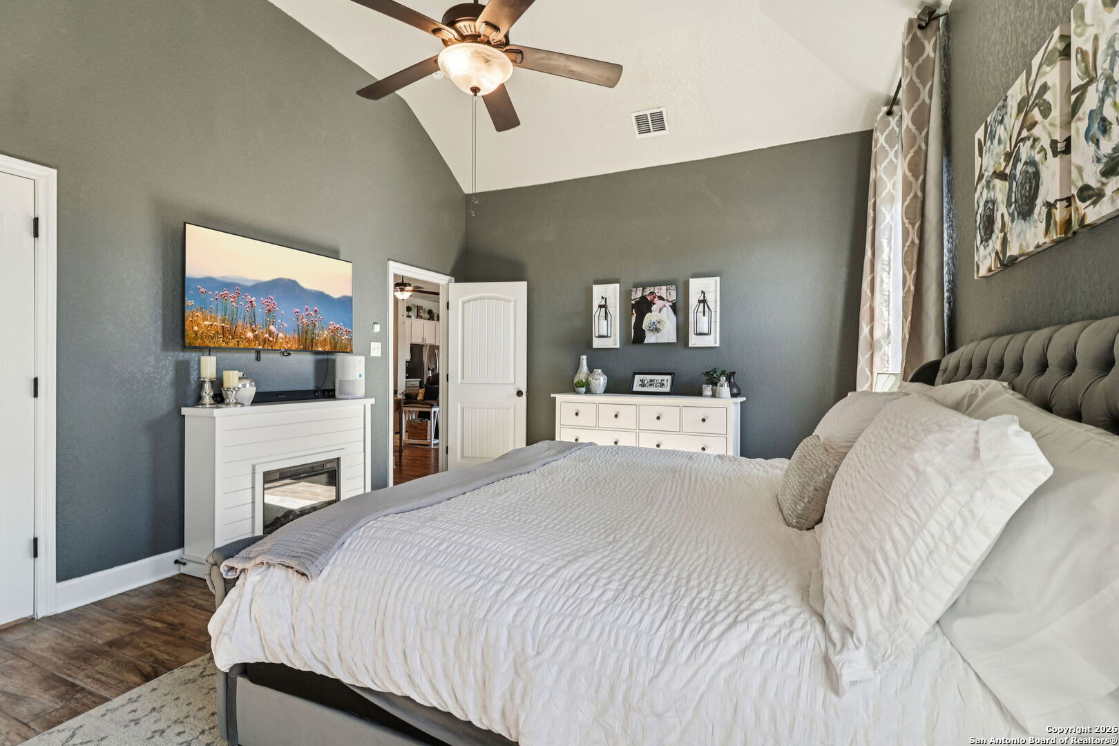 1074 Boulder New Braunfels, TX 78132 - Photo 24 of 40 a bedroom with a bed and a chandelier