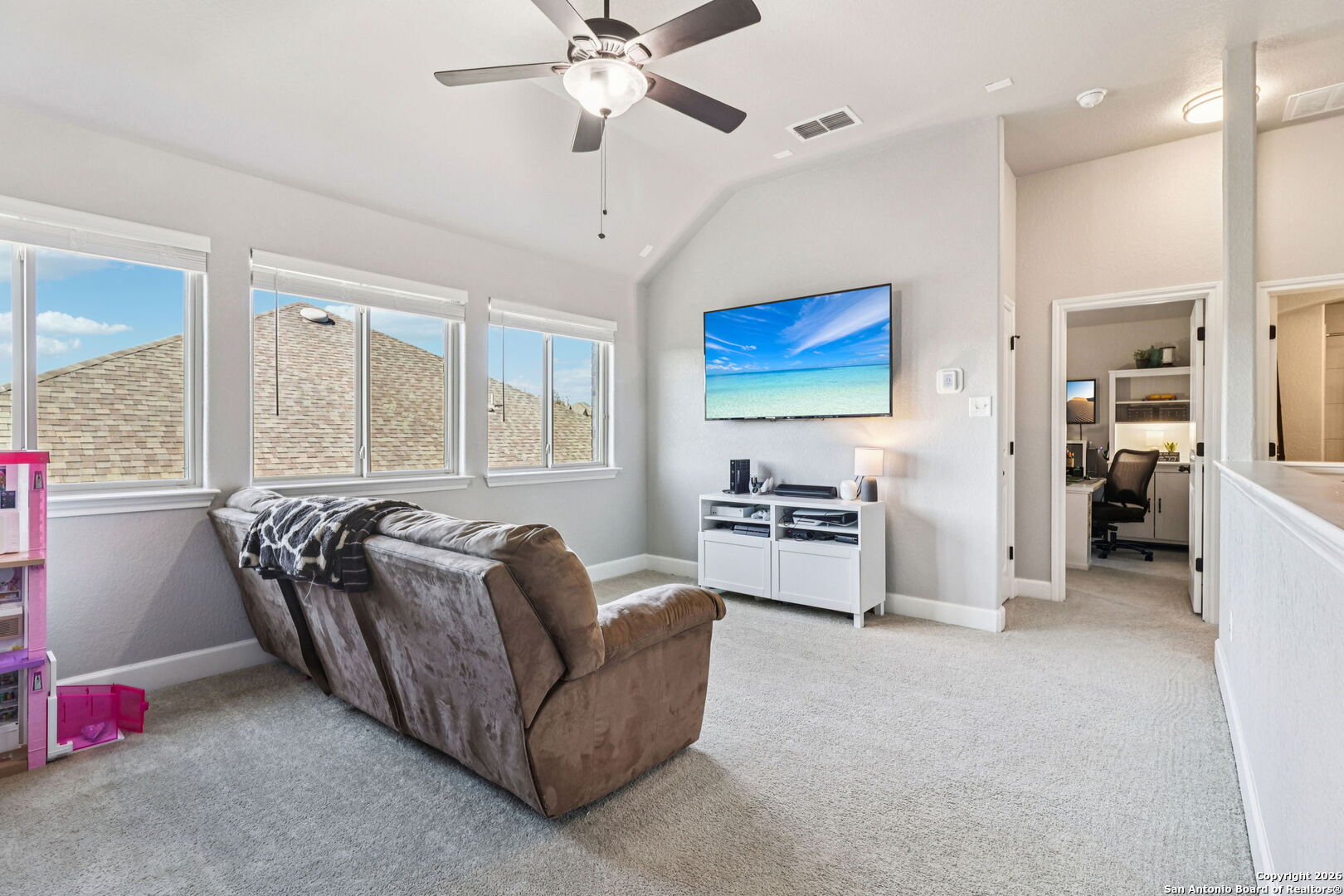 1074 Boulder New Braunfels, TX 78132 - Photo 27 of 40 a living room with furniture and a chandelier