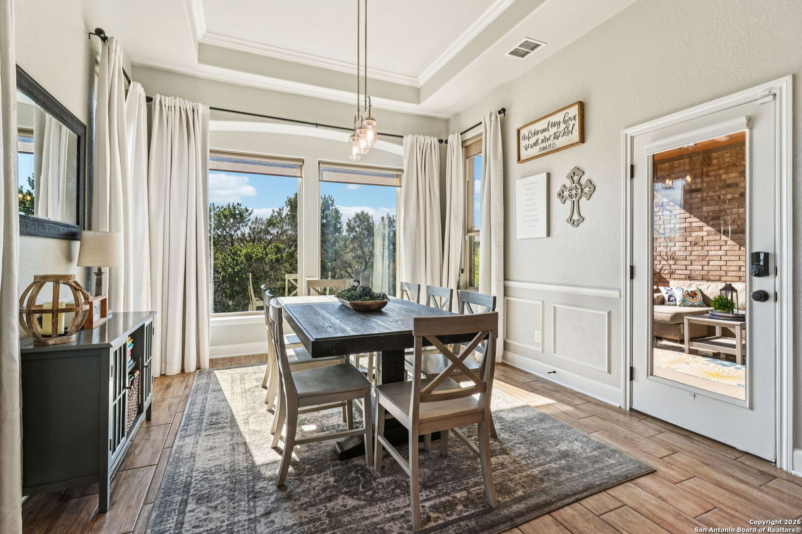 1074 Boulder New Braunfels, TX 78132 - Photo 10 of 40 a view of a dining room with furniture window and wooden floor