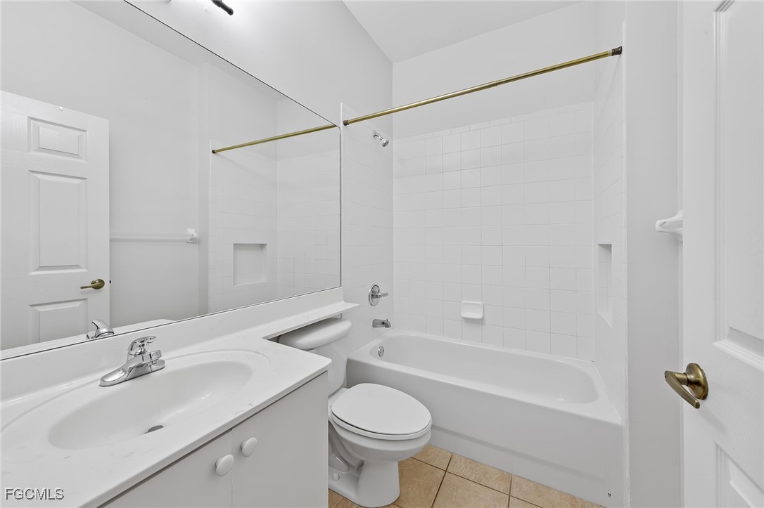 14764 Pinnacle Place, Unit 65 Naples, FL 34119 - Photo 12 of 50 a bathroom with a sink toilet and shower
