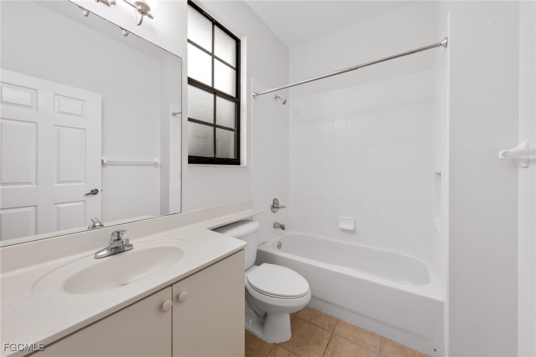 14764 Pinnacle Place, Unit 65 Naples, FL 34119 - Photo 24 of 50 a bathroom with a sink toilet and shower
