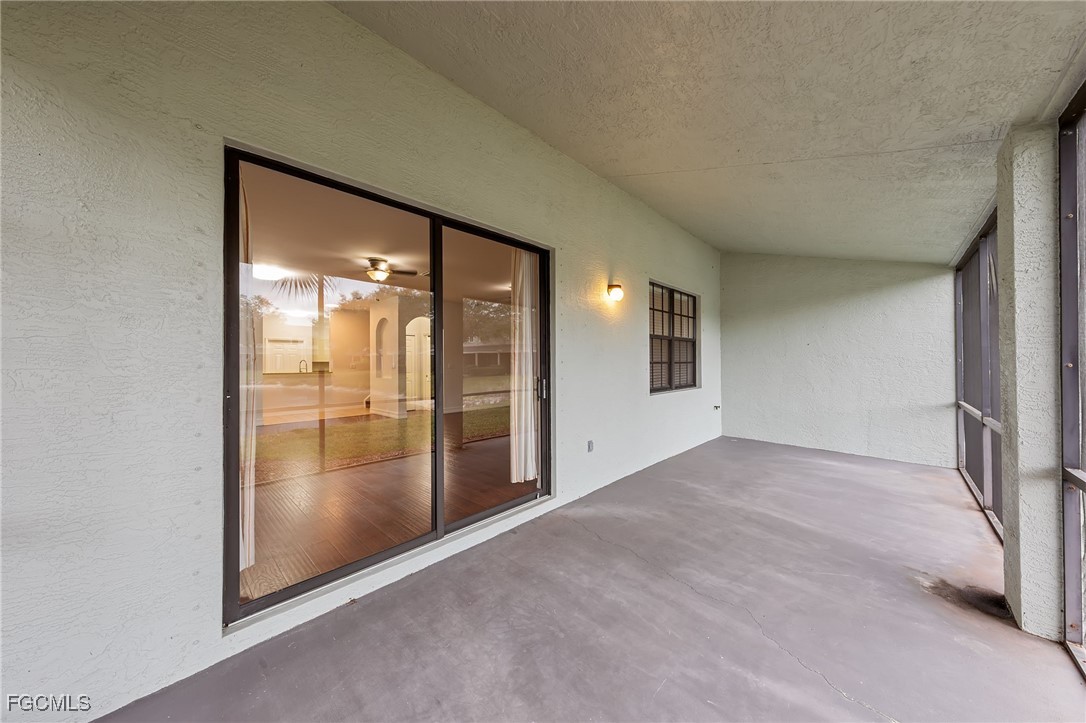 14764 Pinnacle Place, Unit 65 Naples, FL 34119 - Photo 35 of 50 an empty room with sliding glass door and shower
