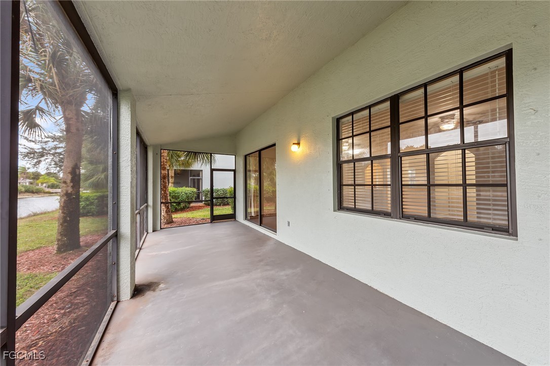 14764 Pinnacle Place, Unit 65 Naples, FL 34119 - Photo 37 of 50 a view of an empty room with a large window