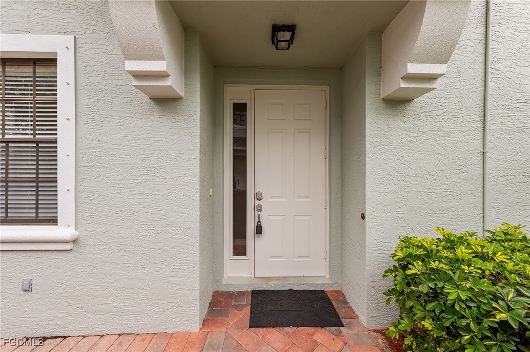 14764 Pinnacle Place, Unit 65 Naples, FL 34119 - Photo 4 of 50 a view of front door