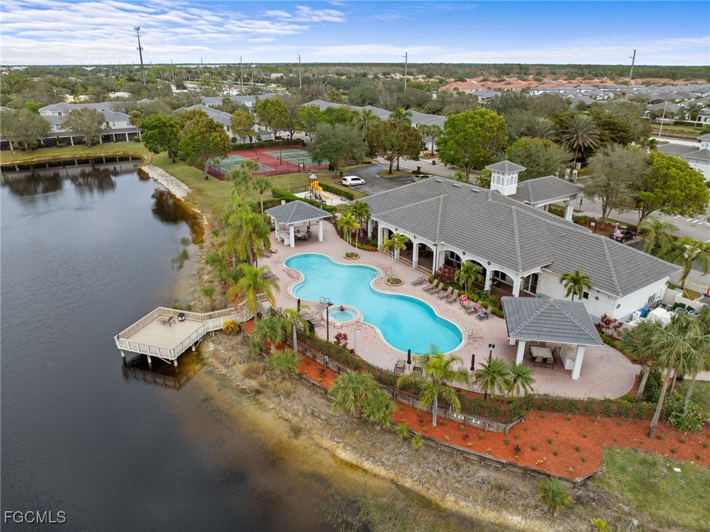 14764 Pinnacle Place, Unit 65 Naples, FL 34119 - Photo 43 of 50 an aerial view of a house with a lake view