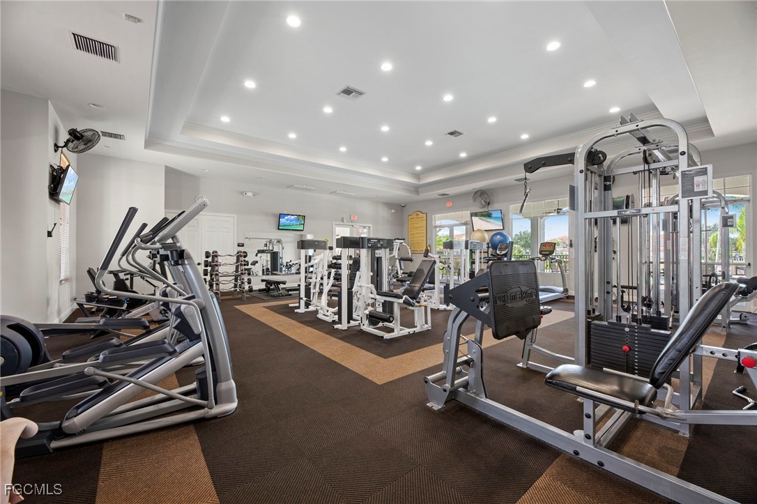 14764 Pinnacle Place, Unit 65 Naples, FL 34119 - Photo 48 of 50 a view of a room with gym equipment