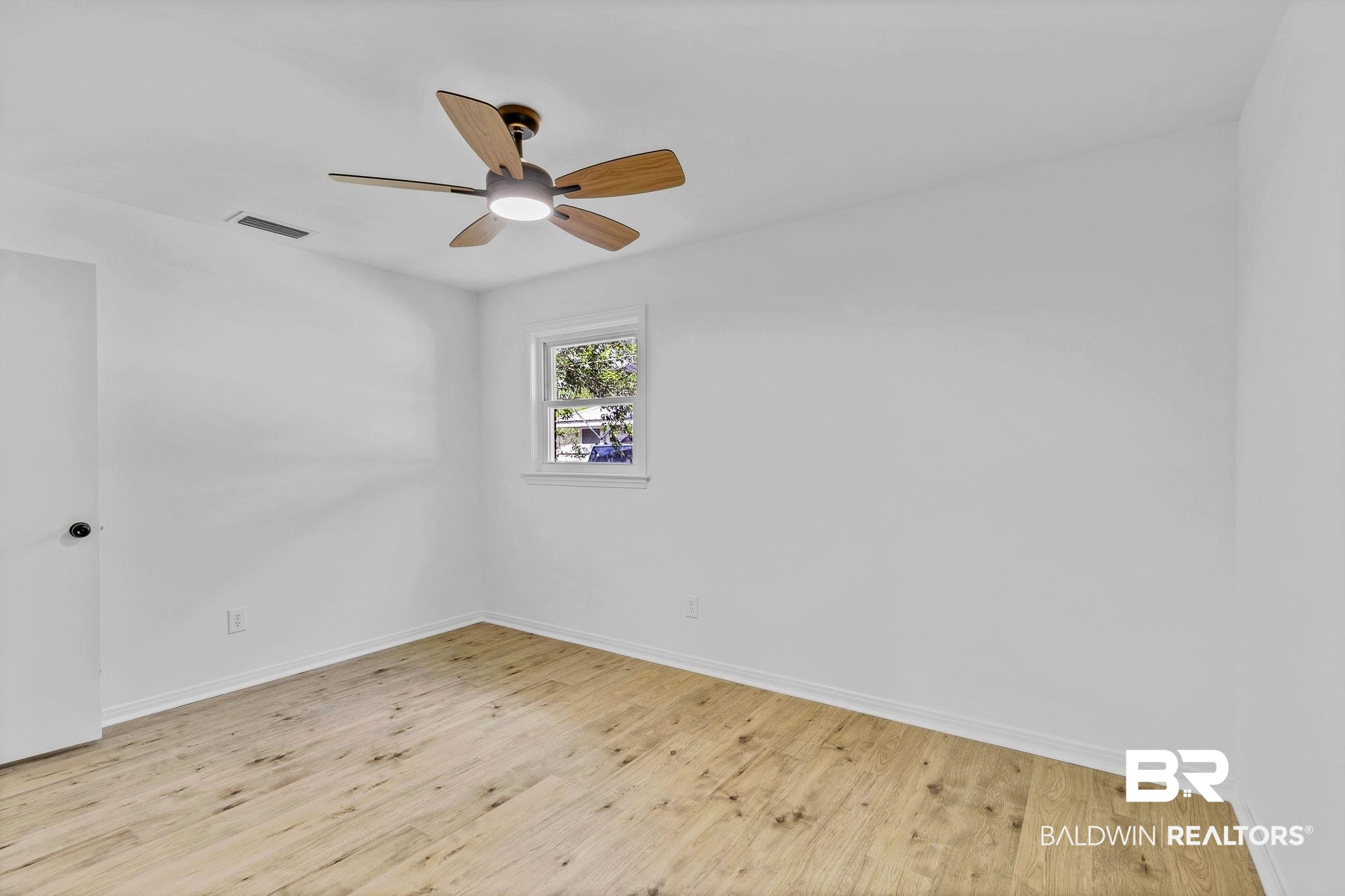 203 Anderson Road Saraland, AL 36571 - Photo 22 of 48 Unfurnished room with visible vents, baseboards, a ceiling fan, and wood finished floors
