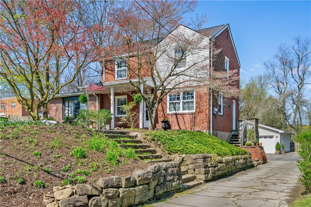 8263 Peebles Road Pittsburgh, PA 15237 - Photo 1 of 49 a view of a brick building next to a yard
