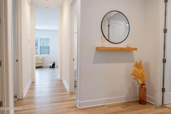 a view of a bedroom from a hallway