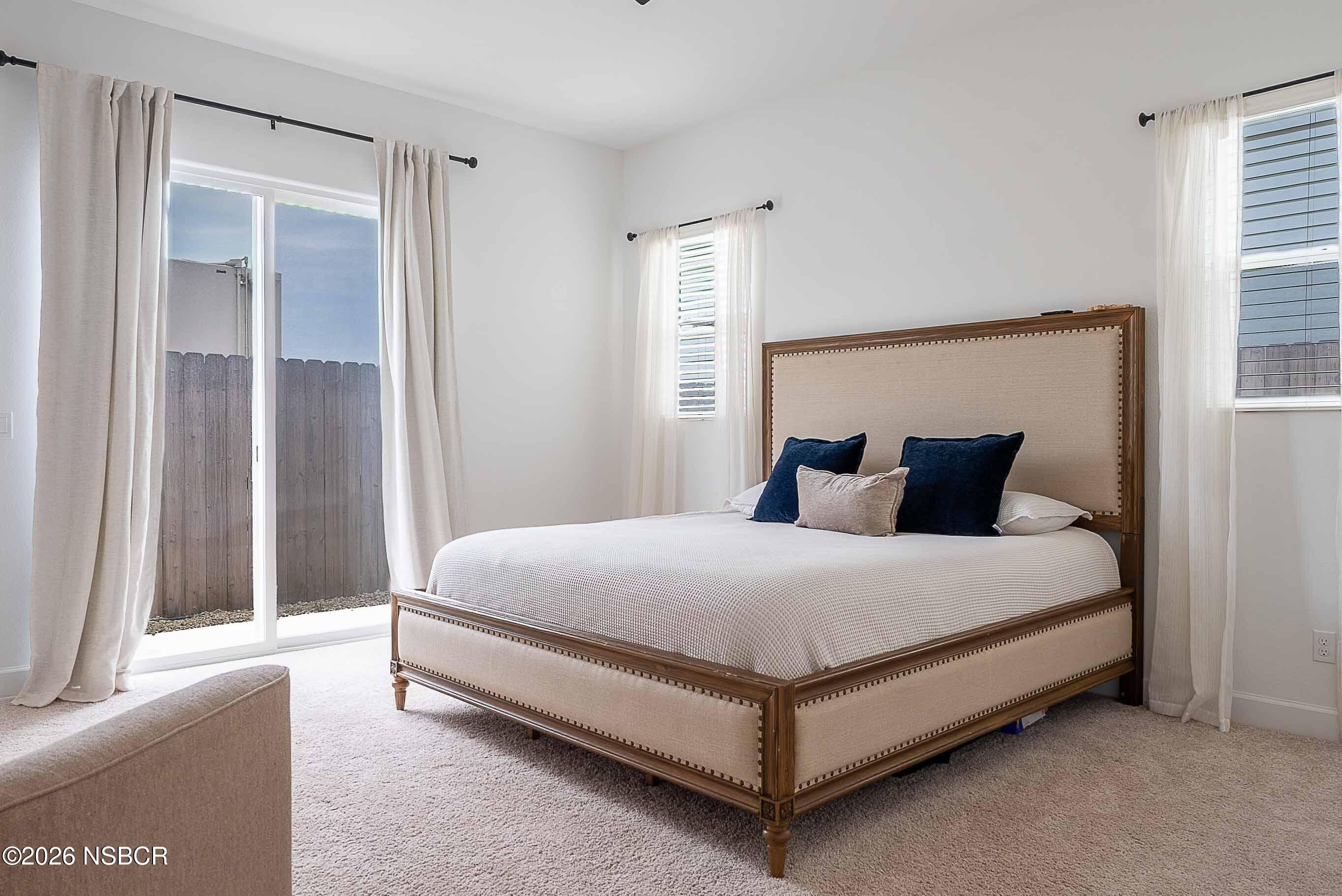 751 Skyview Lane Santa Maria, CA 93455 - Photo 14 of 27 a large bed sitting in a bedroom next to a window
