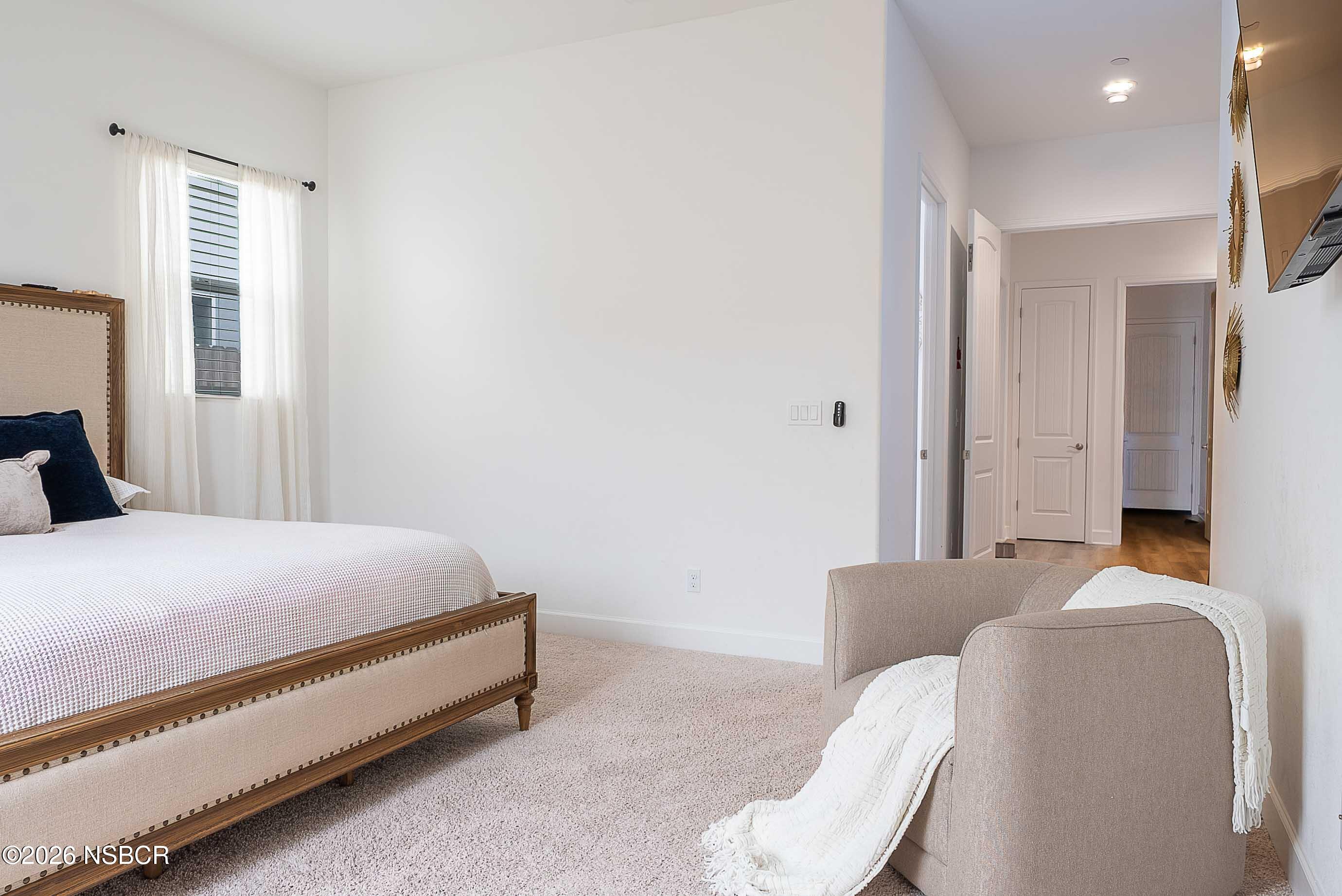 751 Skyview Lane Santa Maria, CA 93455 - Photo 15 of 27 a bedroom with a bed and a couch