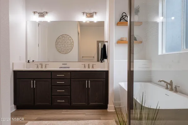a bathroom with a bathtub and shower