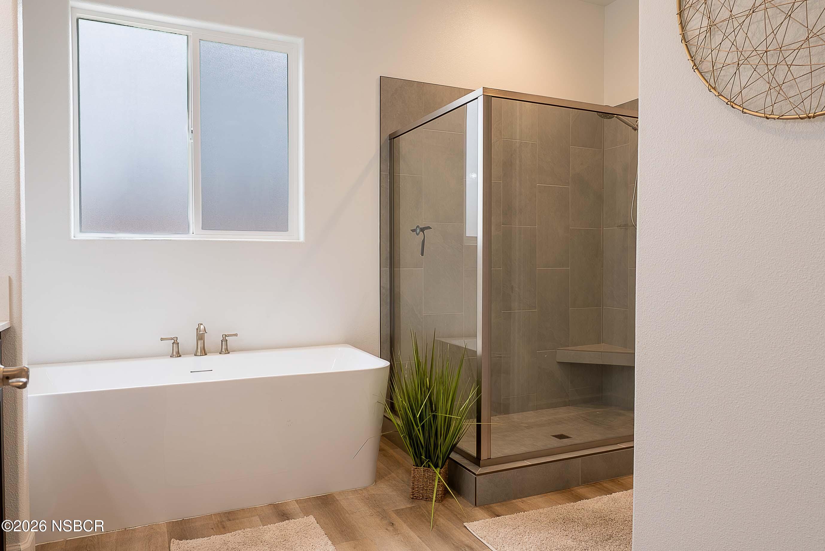 751 Skyview Lane Santa Maria, CA 93455 - Photo 18 of 27 a bathroom with a bathtub and shower