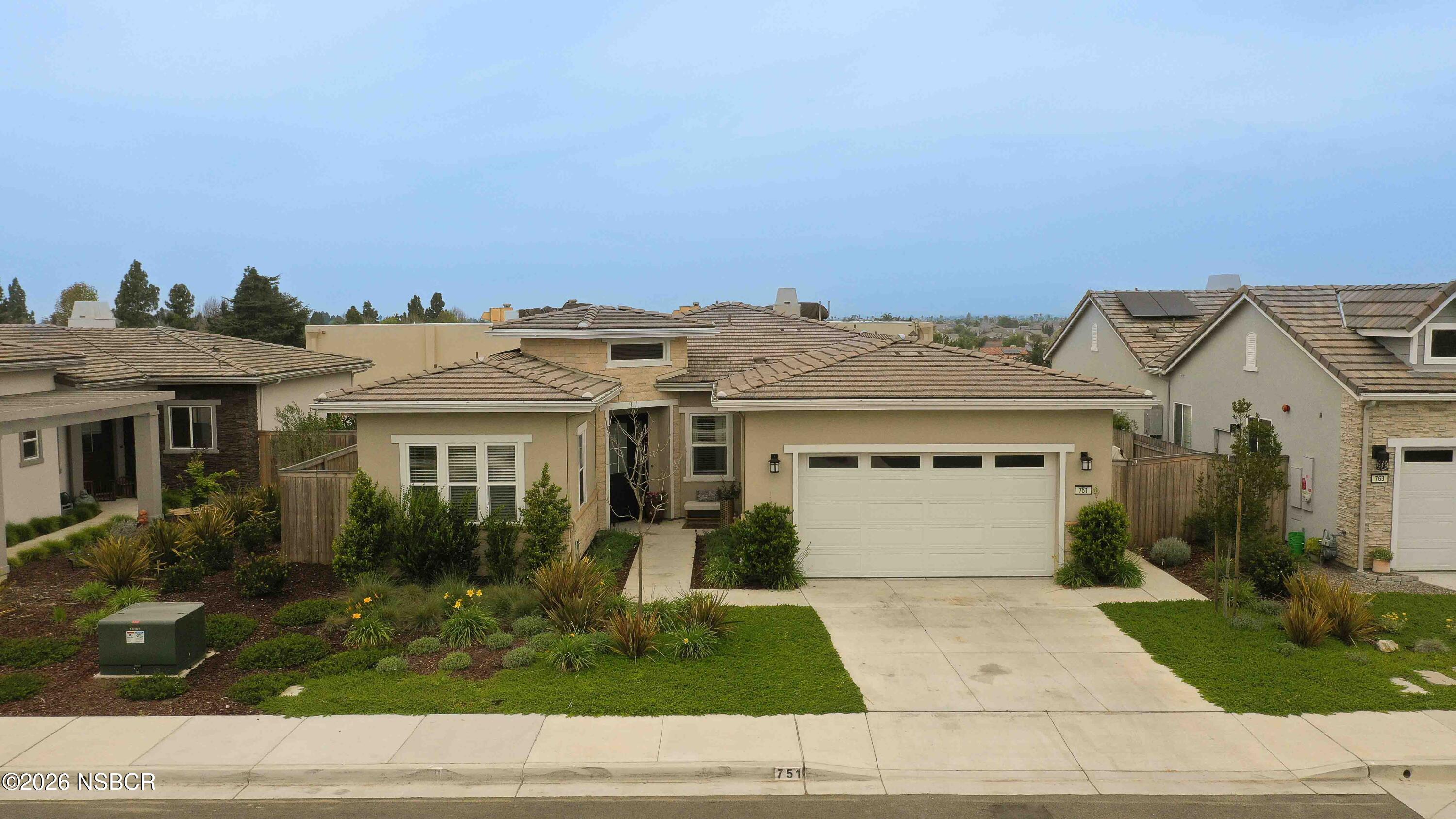 751 Skyview Lane Santa Maria, CA 93455 - Photo 2 of 27 a view of a white house with a outdoor space