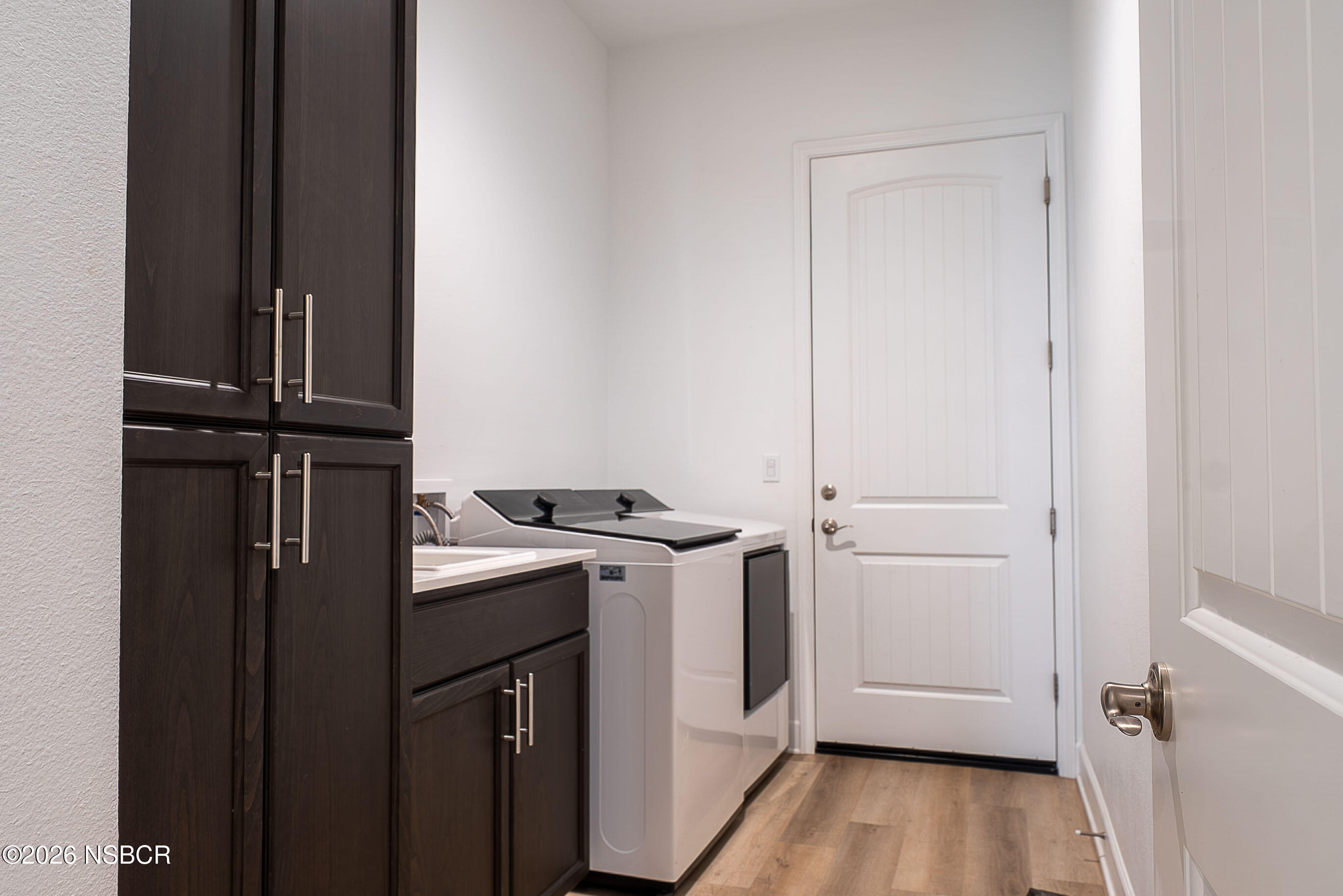 751 Skyview Lane Santa Maria, CA 93455 - Photo 22 of 27 a view of a kitchen with a stove wooden floor