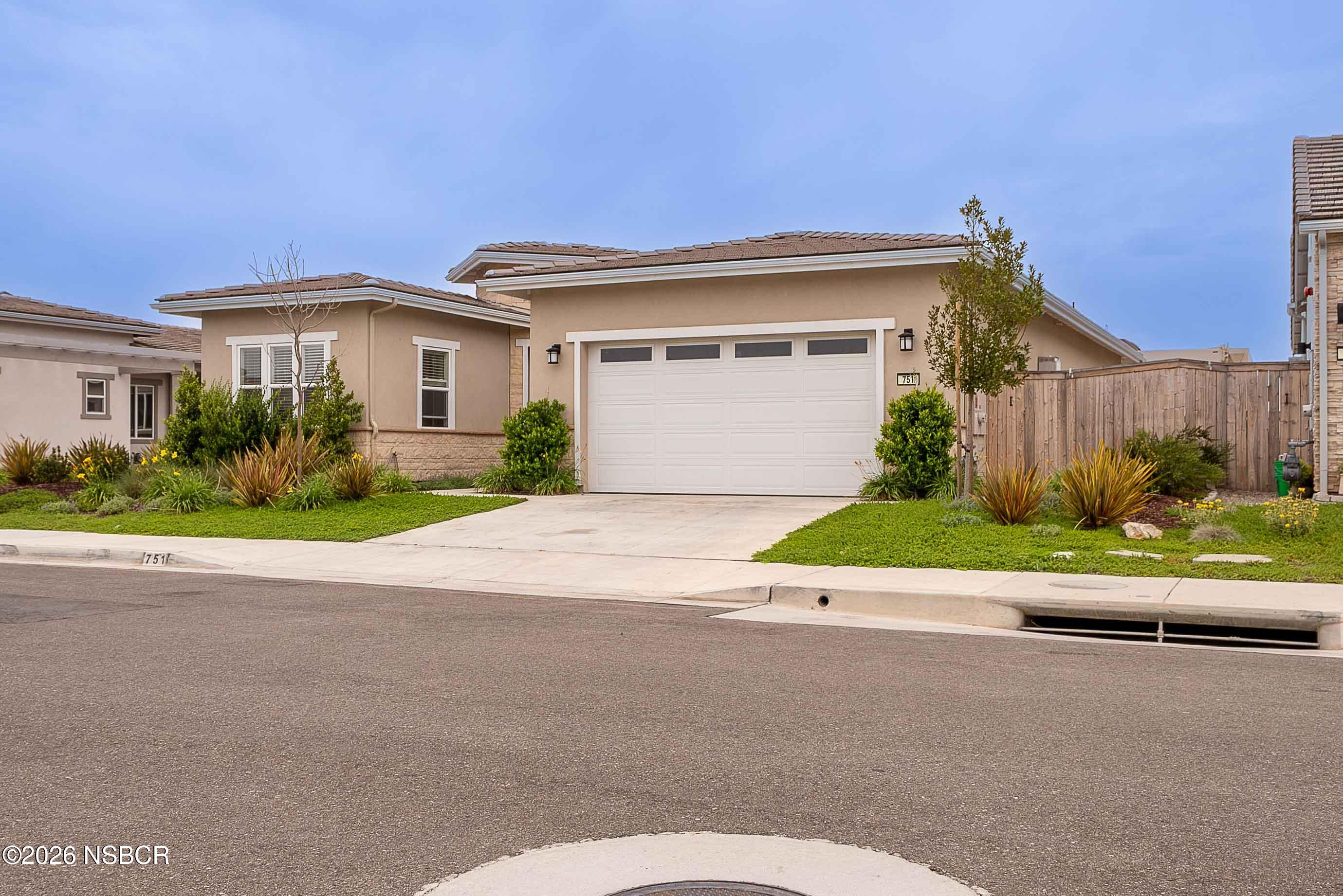 751 Skyview Lane Santa Maria, CA 93455 - Photo 26 of 27 a front view of a house with a garden and plants