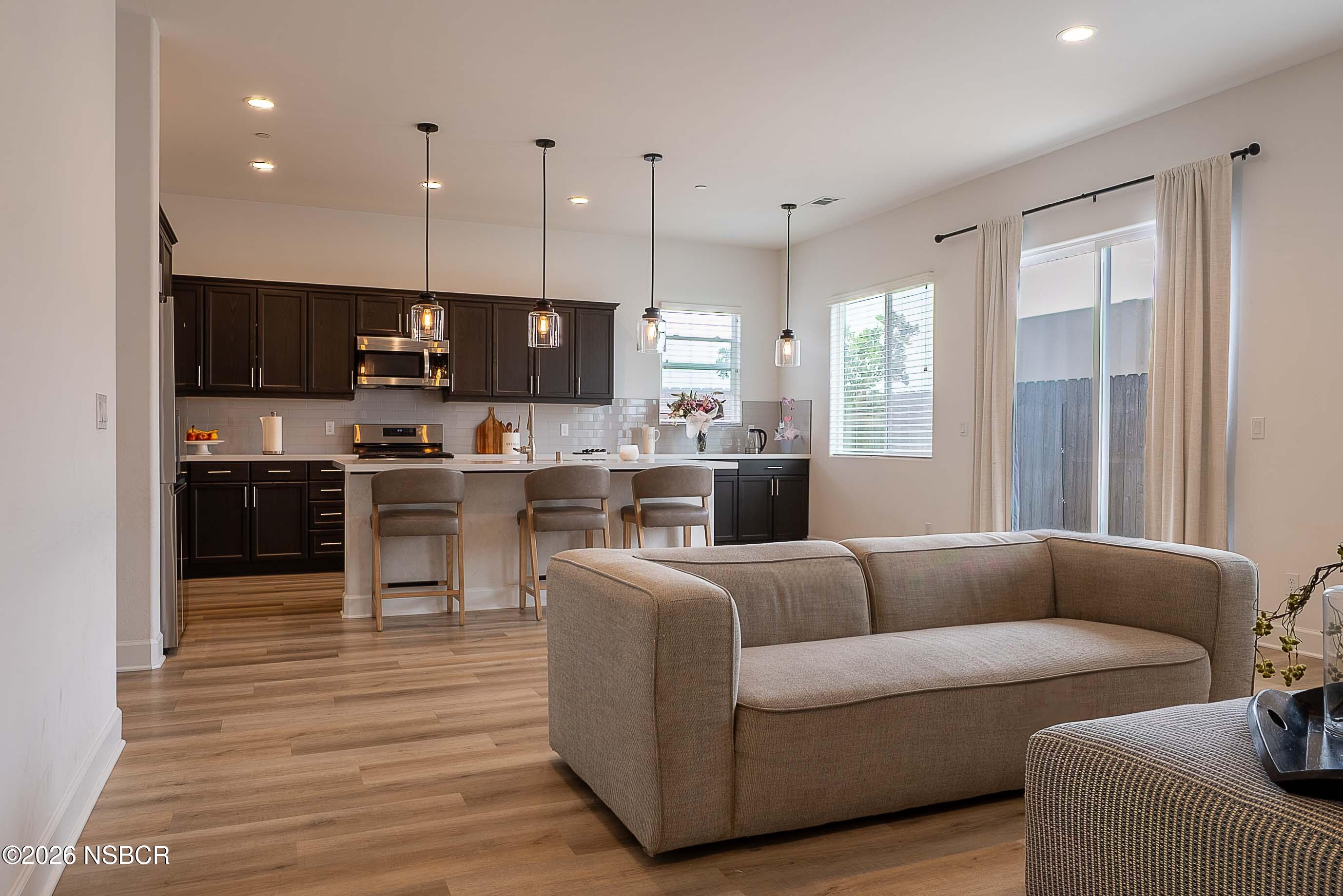 751 Skyview Lane Santa Maria, CA 93455 - Photo 7 of 27 a living room filled with furniture and a flat screen tv