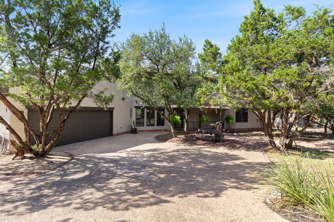 View of front facade with driveway and an attached garage