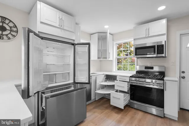 a kitchen with a stove oven and a refrigerator