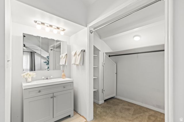 460 Omni Point Road Central Valley, UT 84754 - Photo 60 of 101 Bathroom vanity with a white countertop and gray shaker-style cabinetry, featuring a medicine cabinet and a four-bulb vanity light