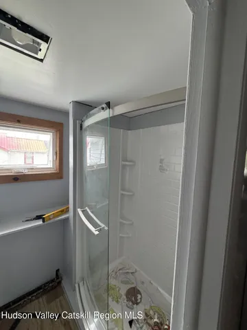 a bathroom with a toilet a sink and a window