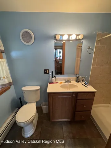 a backyard of a house with a yard and outdoor seating