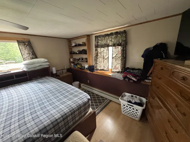 a view of hallway with wooden floor