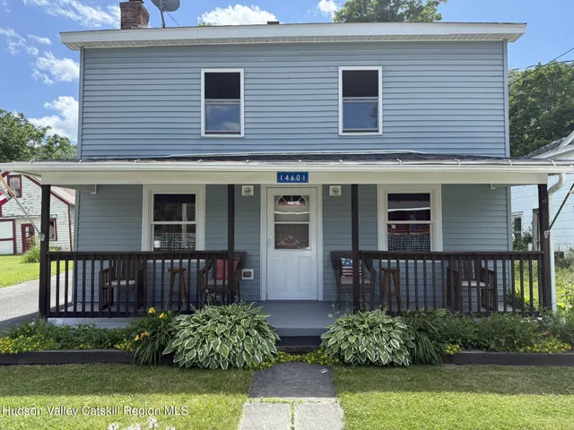 a view of a yard with a tree
