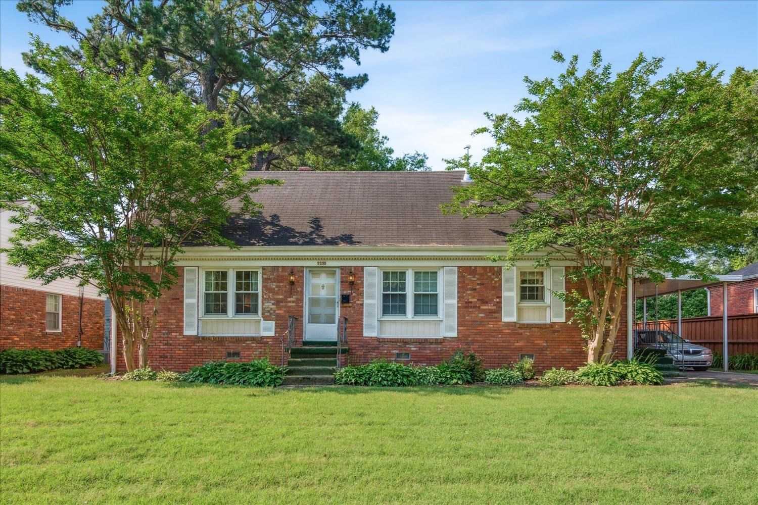 front view of a house with a yard